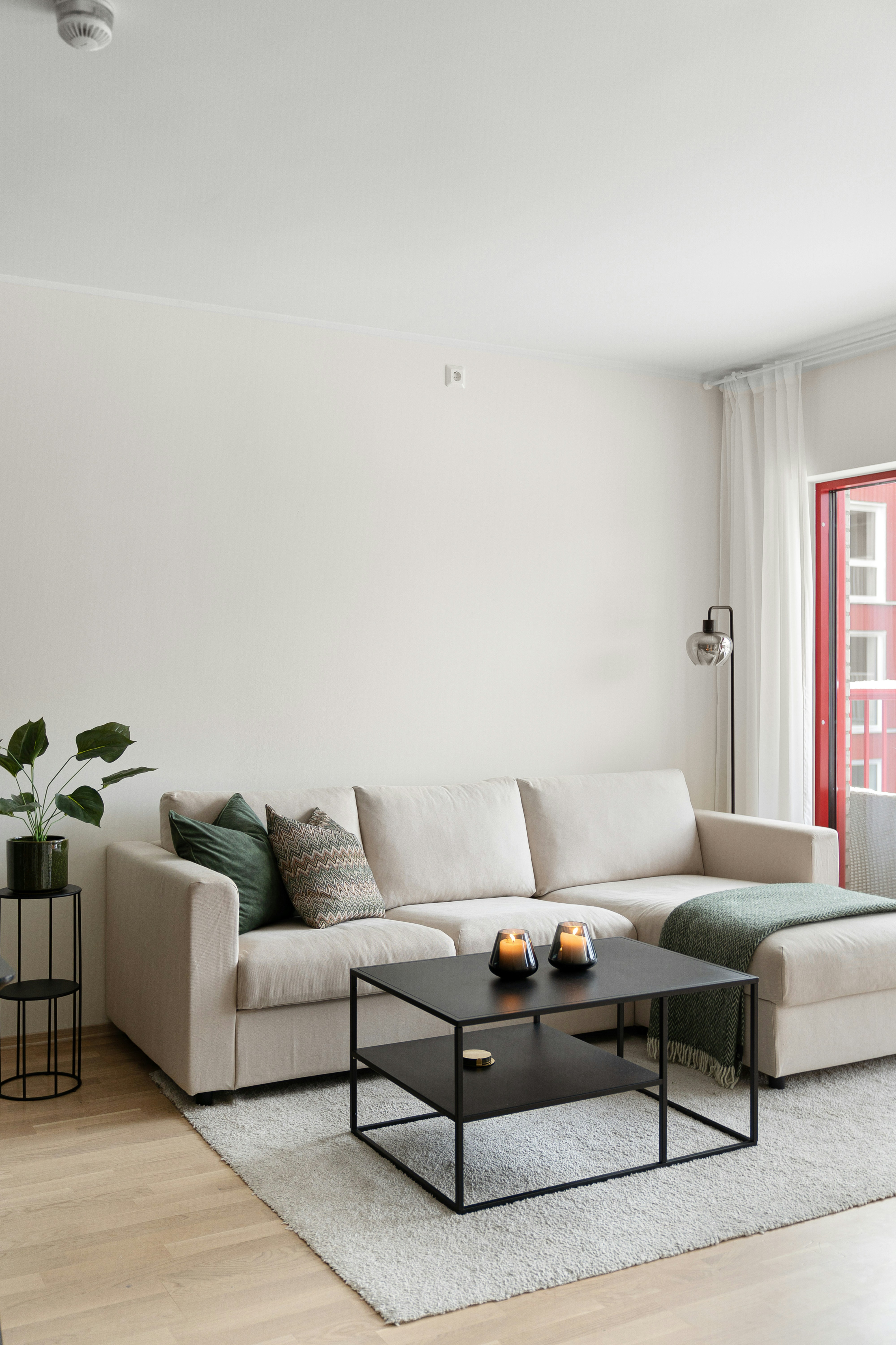 A living room filled with furniture and a large window